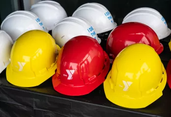Hard Hats with Y Logos on them
