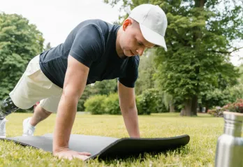 Man doing a pushup outside