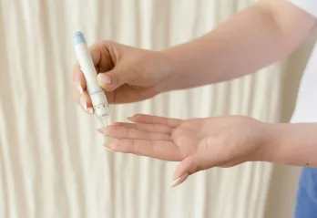 Person testing their blood sugar