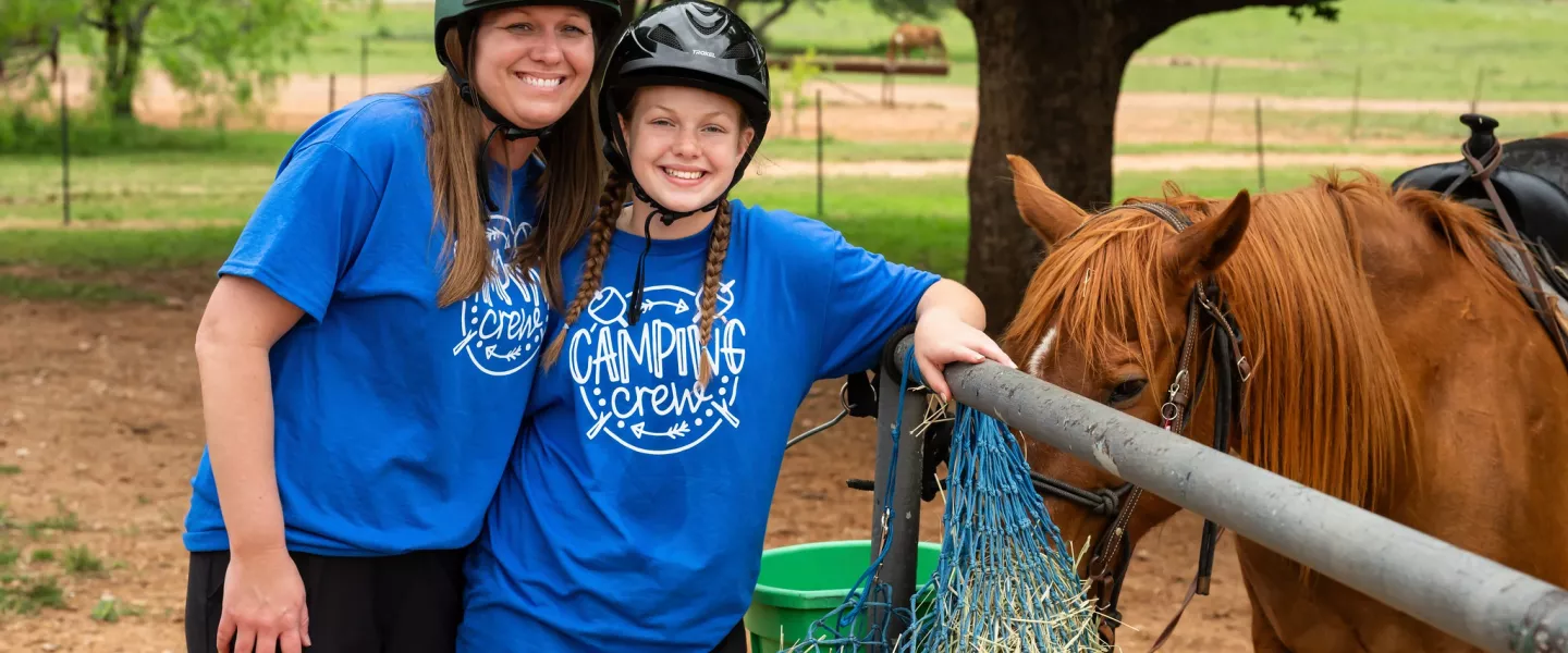 Mom and Daughter with horse at camp