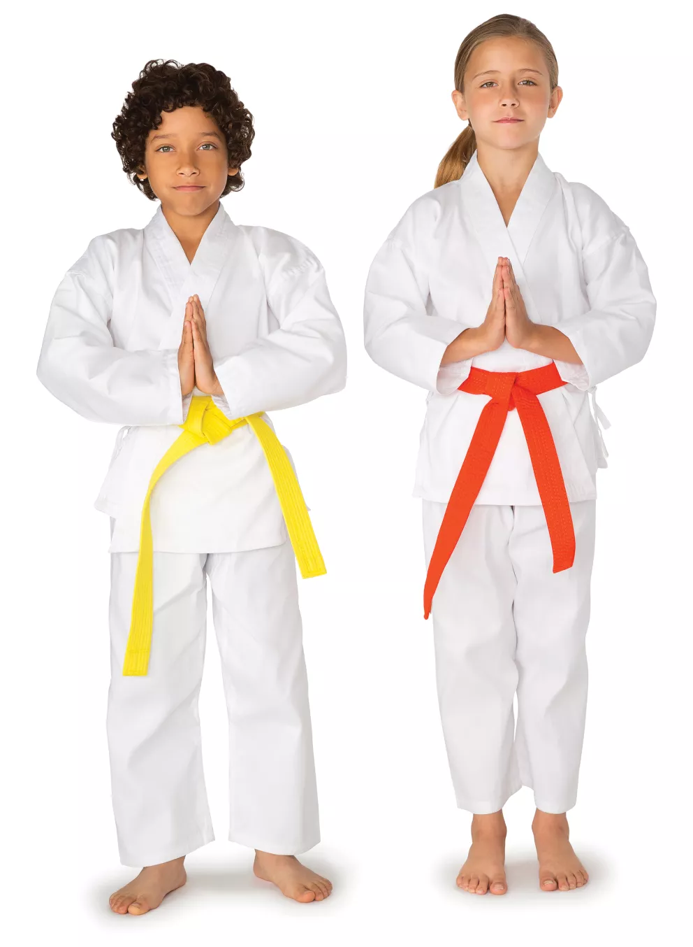 two children in martial arts uniforms