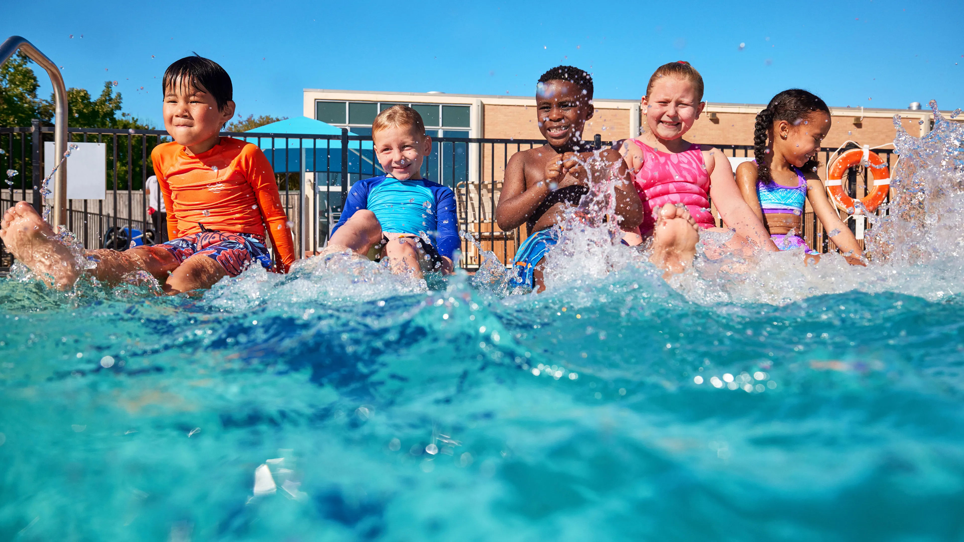 kids splashing in the pool