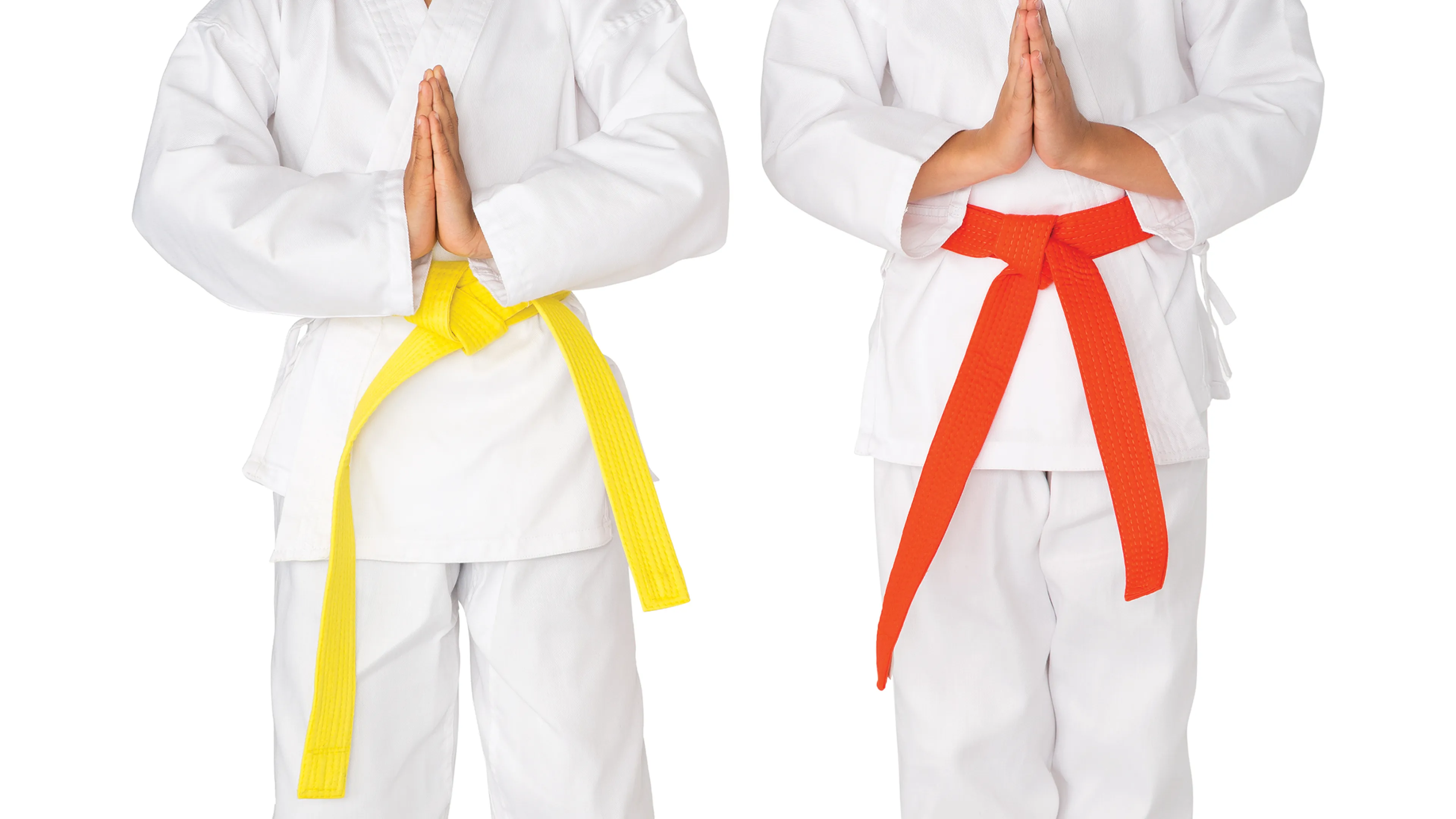 two children in martial arts uniforms
