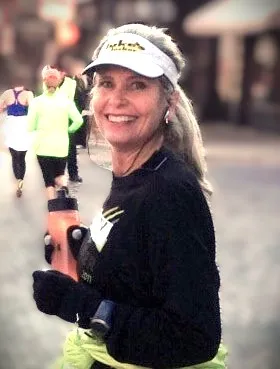 Christy posing at Turkey Trot with her water bottle