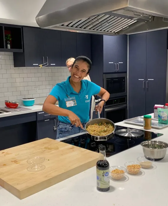 Photo of Bea posting during cooking demo
