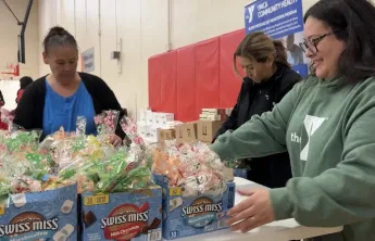 staff packing Christmas boxes for those in need