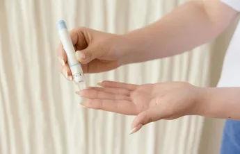 Person testing their blood sugar