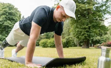 Man doing a pushup outside